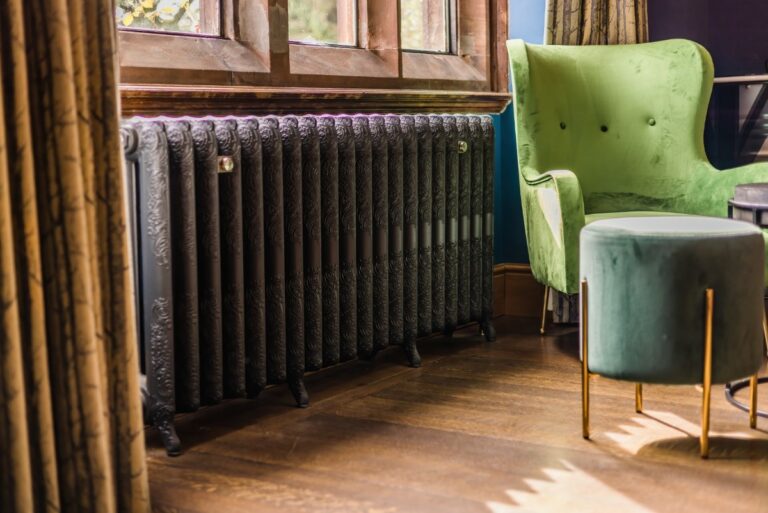 Ornate Rococo 2 Column cast iron radiator by Castrads in Edwardian country house.